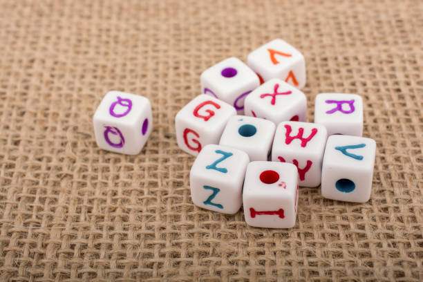 istock Colorful alphabet letter cubes on a canvas 647363072