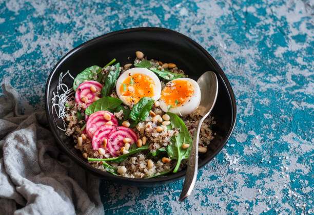 istock Healthy diet food - salad with quinoa, spinach, beets and boiled egg. 647363324