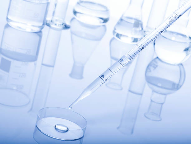 istock Test-tubes on a white and blue background. 647365640