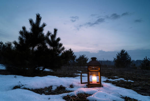 istock Wooden lantern with a candle in the evening. 647365834