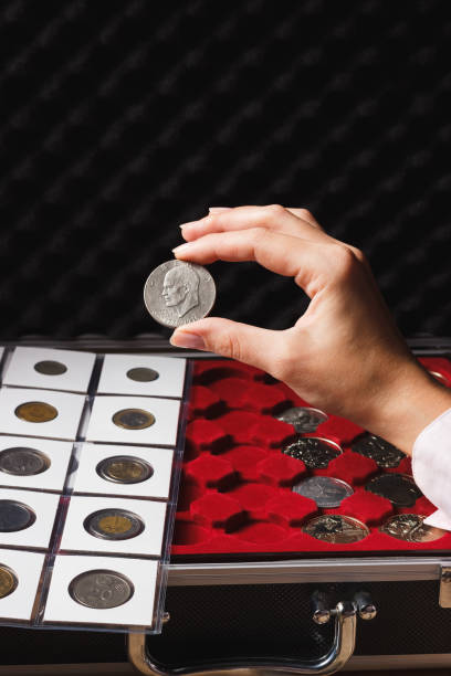 istock Dollar coin in the woman’s hand 647366000