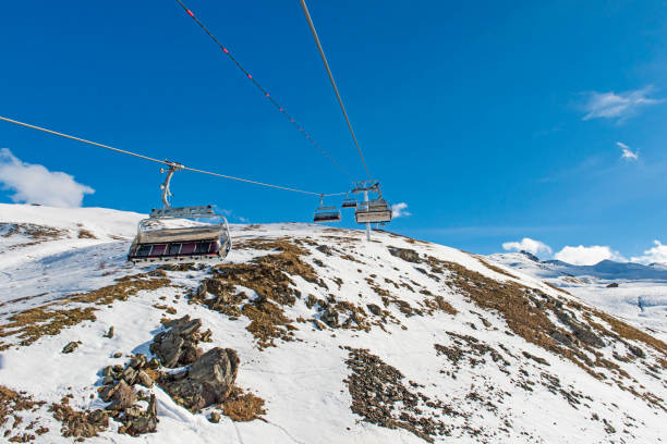 istock Panoramic view of an alpine mountainside with ski lift 647366292