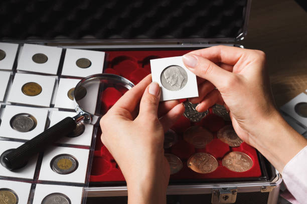 istock Dollar coin in the woman’s hand 647366490
