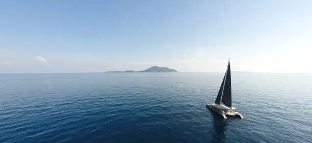 Amazing view to Yacht sailing in open sea at windy day. Drone view - birds eye angle. - Boost up color Processing.