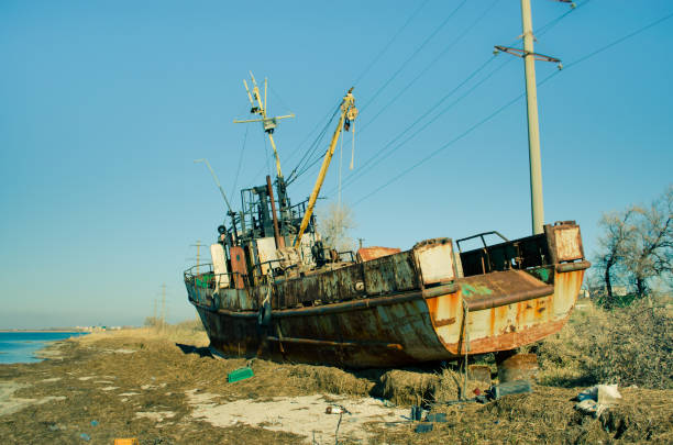 istock The rusty fishery vessel on a dump. 647369912