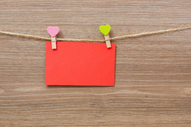 istock Red greeting card hanging on a clothesline. 647373778