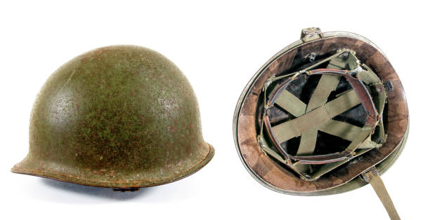 istock Old Military Helmet Isolated on White.Two old rusty military helmet 647374306
