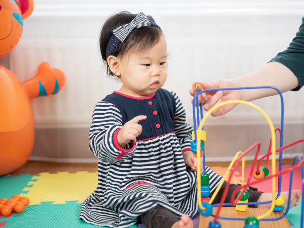istock Baby girl play abacus at home 647376954