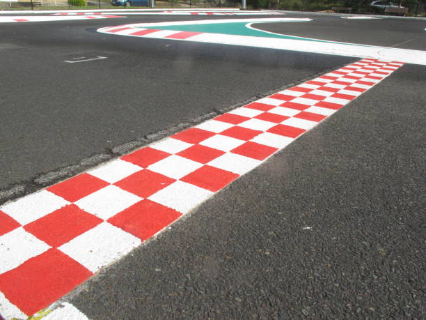istock finish line in finish racetrack, red and white color 647384350