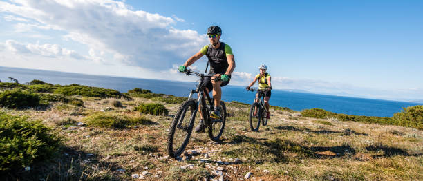 istock Couple mountain biking 647385130