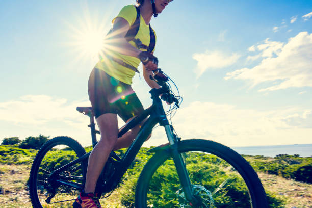 istock Woman mountain biking