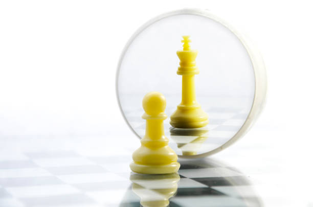 istock pawn pieces on the chessboard, the reflection in the mirror king 647387944