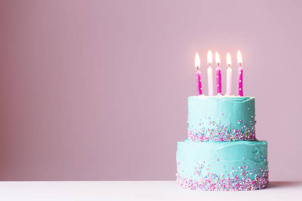 istock Birthday cake with pink candles 647398640