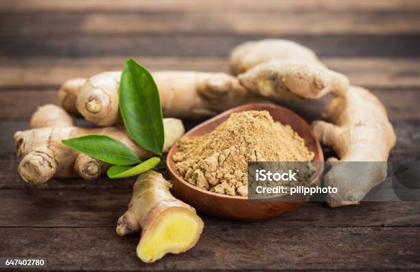 Ginger Root And Ginger Powder In The Bowl Stock Photo - Download Image Now - Ginger - Spice, Ground - Culinary, Freshness