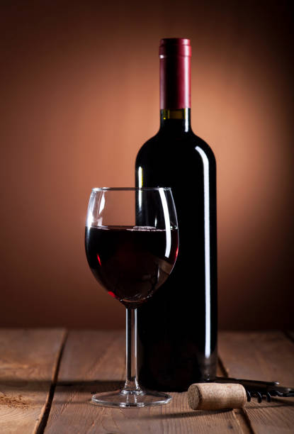 istock Red wine bottle and glass 647405806
