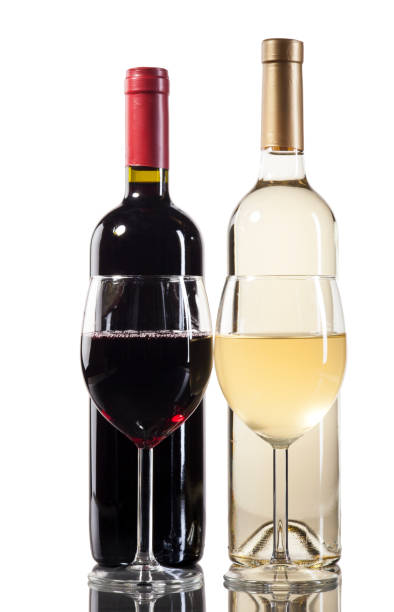 istock Red and white wine bottles with glasses 647405850