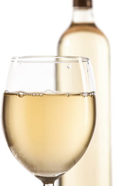Wineglass and bottle with white wine isolated on white background