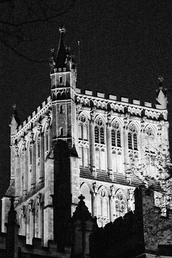 Bristol Cathedral viewed at night in black and white with the tower picked out by search lights.