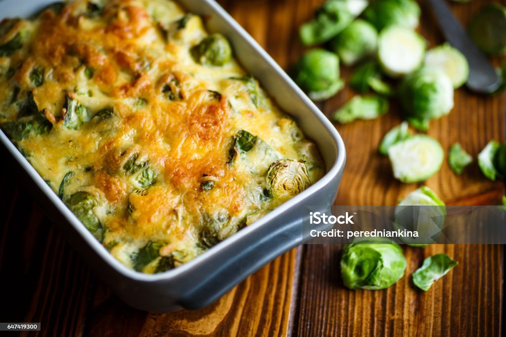 Brussels sprouts baked in sauce with cheese Brussels sprouts baked in sauce with cheese in a ceramic form Brussels Sprout Stock Photo