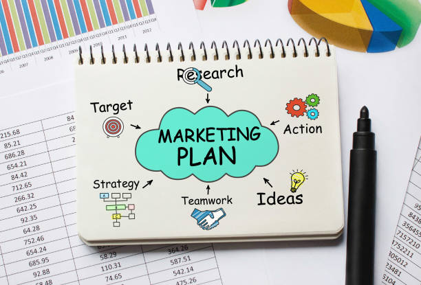 istock Notebook with Toolls and Notes about Marketing Plan 647419348