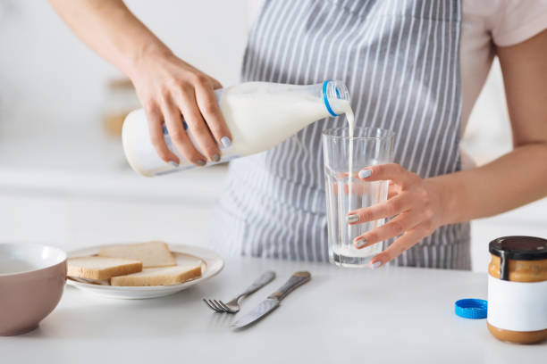 istock Elegant young mother cooking breakfast 647436522