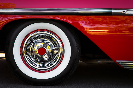 The white wall tires of a fifties classic car.