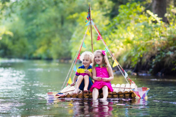 istock Kids on wooden raft 647437216