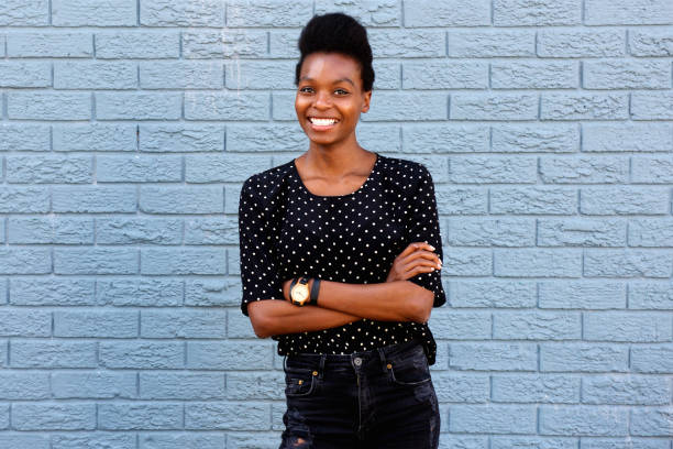 istock Attractive young african woman standing confidently 647437422