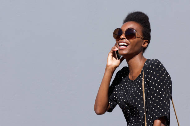istock Stylish african woman talking on cellphone 647437530