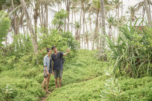 istock Couple taking selfie in lush forest, Sri Lanka 647438312