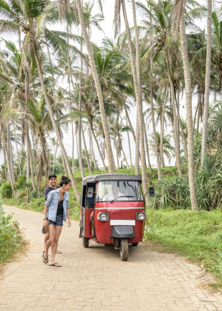 istock Mid adult couple on path with rickshaw, Sri Lanka 647438602
