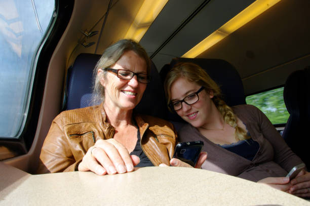 istock Mother with  daughter in train 647438608