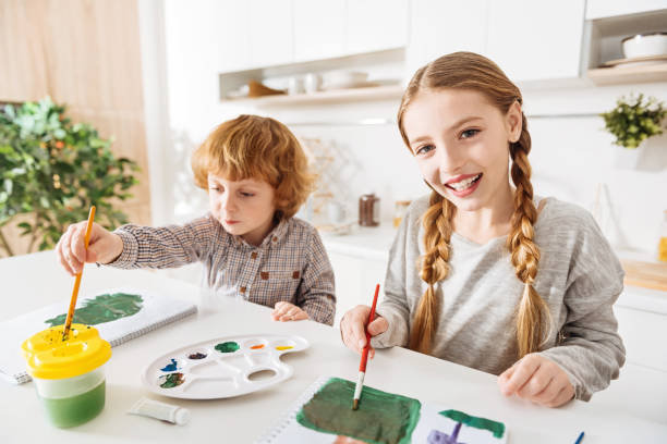 istock Admirable little artists testing their new watercolors 647441178