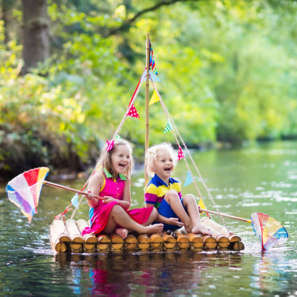 istock Kids on wooden raft 647441400