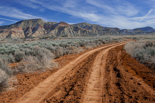 A rough dirt road leads into the North Fruita Desert in western Colorado.