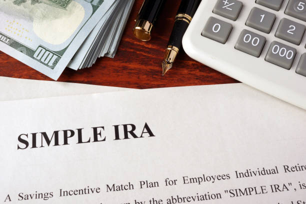 istock Papers with simple ira and book on a table. 647448586
