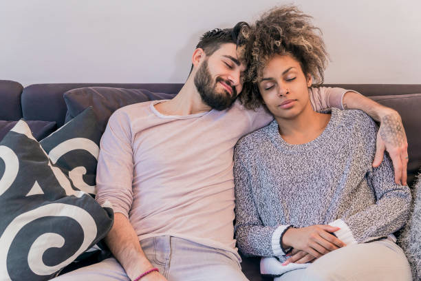 istock peaceful young couple sleeping comfortably 647449392