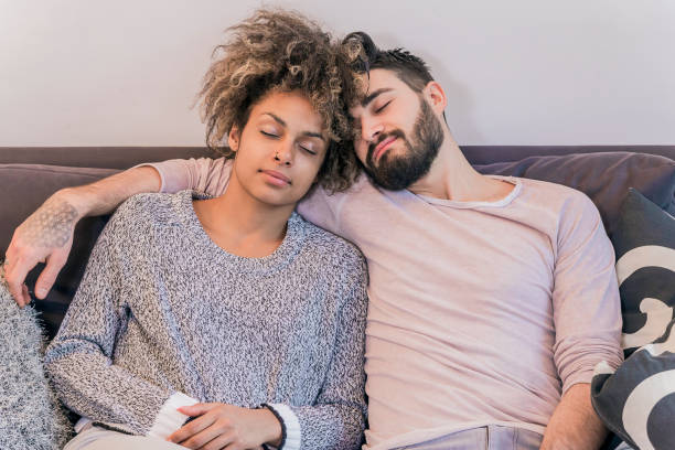 Couple Sleeping soundly on the sofa