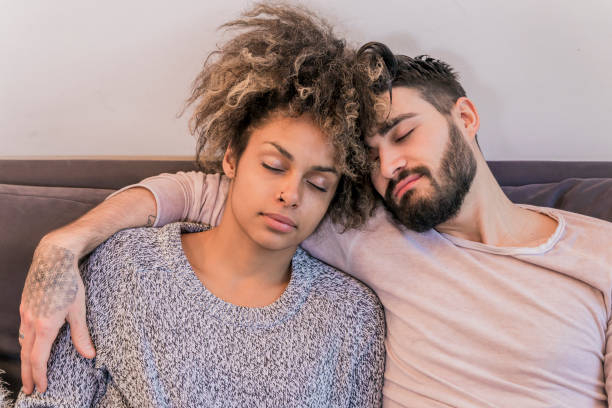 istock Top view of beautiful young  couple  sleeping 647449404