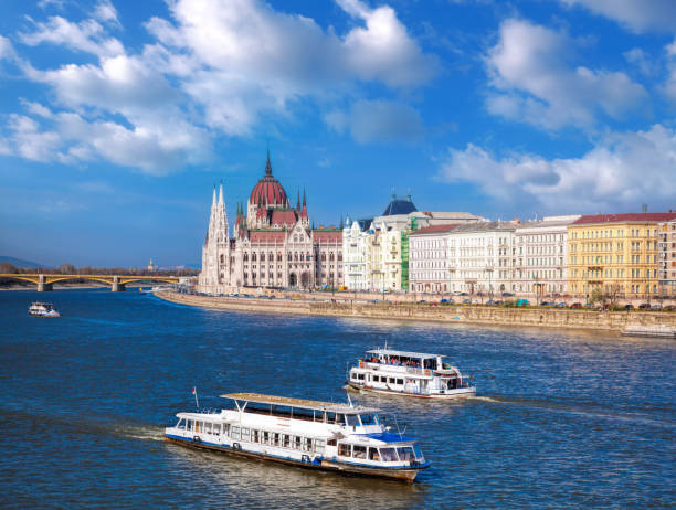 istock Budapest Parliament with boats on Danube river in Hungary 647451904