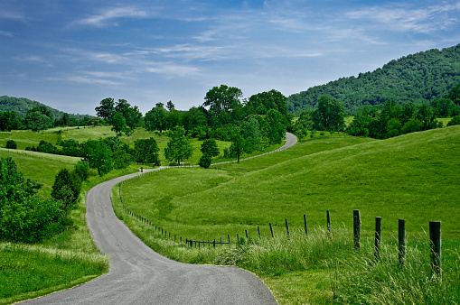 A less-traveled road winds through the foothills of the Blue Ridge Mountains in western Virginia.