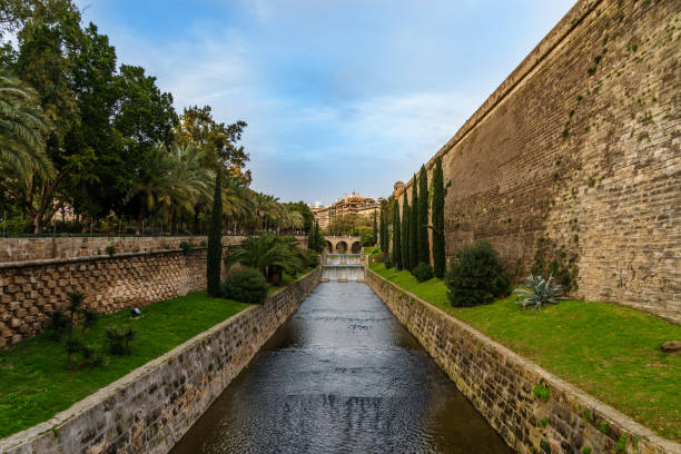 istock bridge on a canal in a mediterranean park 647456220