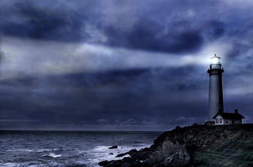 Giant waves with the force of the sea jumping Island and lighthouse.