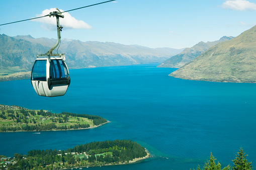 Cable car high above Queenstown and Lake Wakatipu in the Remarkable Mountains of New Zealand.