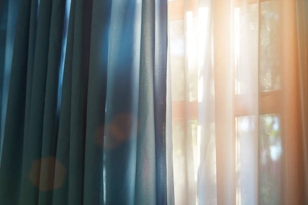 istock Window with curtain in sunny day 647463820