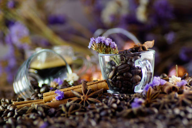Artistic composition of espresso coffee and lavender flower, bokeh light background