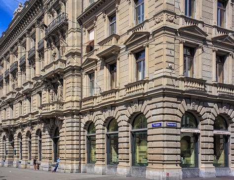 Zurich, Switzerland - 14 May, 2015: building on the corner of Paradeplatz square and Bahnhofstrasse street. Bahnhofstrasse is Zurich's main downtown street and one of the world's most expensive and exclusive shopping avenues, Paradeplatz is a square in Zurich, one of the most expensive pieces of real estate in Switzerland.