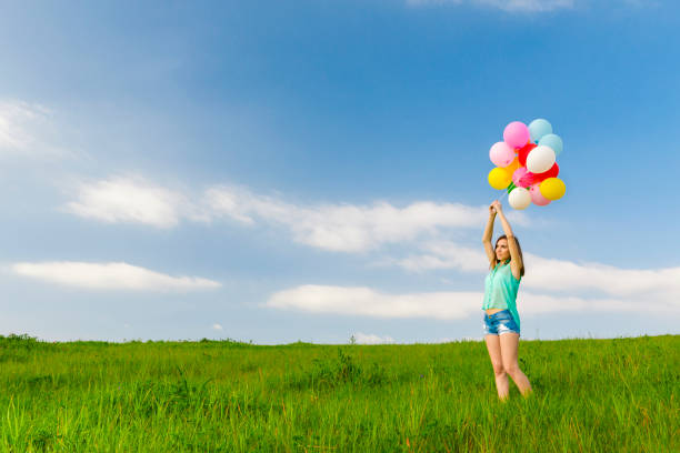 istock Girl with Ballons 647473916