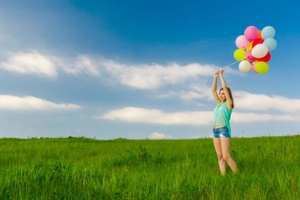 istock Girl with Ballons 647473926