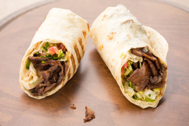 istock Doner kebab on wooden background 647476806